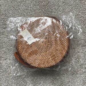 Francesca’s Round Woven Straw Crossbody Bag